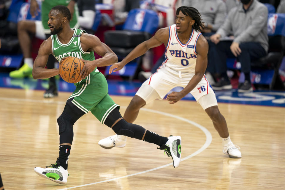 Boston Celtics guard Kemba Walker, left, drives past Philadelphia 76ers guard Tyrese Maxey during the first half of an NBA basketball game Wednesday, Jan. 20, 2021, in Philadelphia. (AP Photo/Chris Szagola)