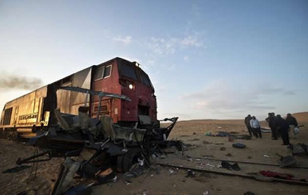 At least 26 people were killed in Egypt when a train ploughed into a truck and a mini-bus at a railway crossing early Monday, the health ministry said. (AFP Photo)