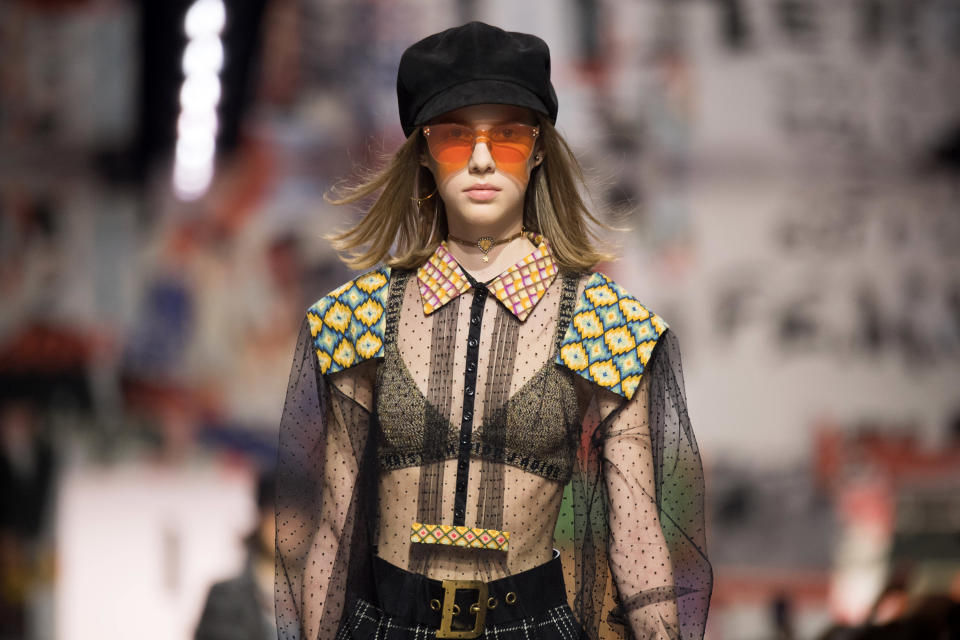 Newsboy caps and orange-tinted sunglasses at Dior Fall 2018. (Photo: Getty Images)