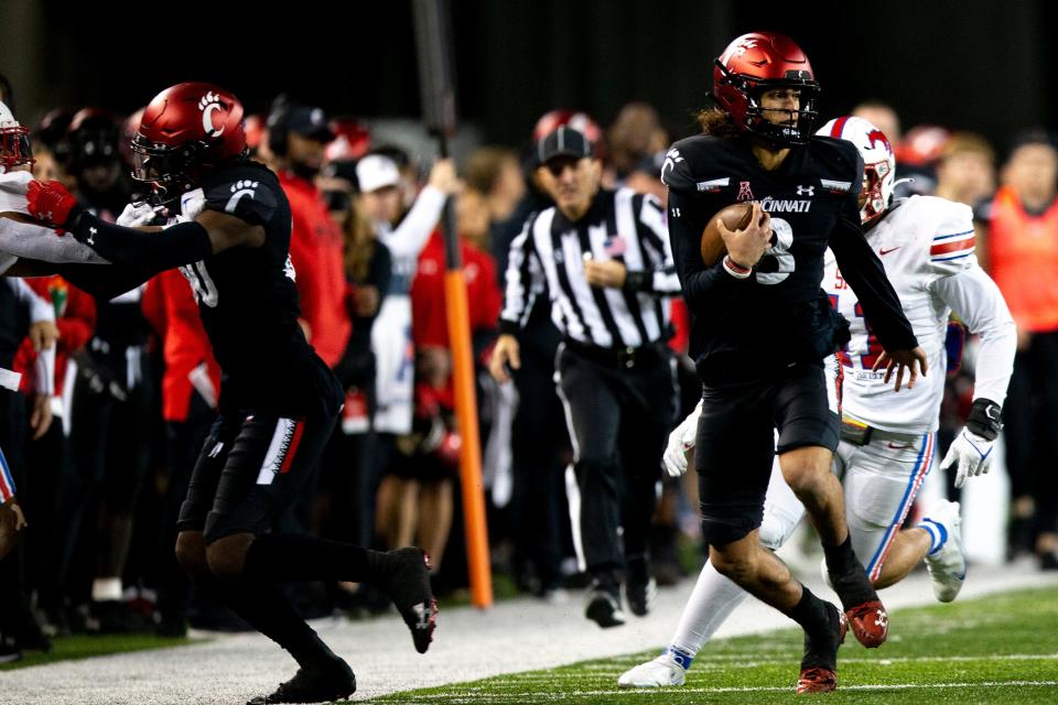 Cincinnati Bearcats quarterback Evan Prater (3) runs downfield in the second half of the NCAA football game on Saturday, Nov. 20, 2021, at Nippert Stadium in Cincinnati. The Cincinnati Bearcats defeated Southern Methodist Mustangs 48-14.