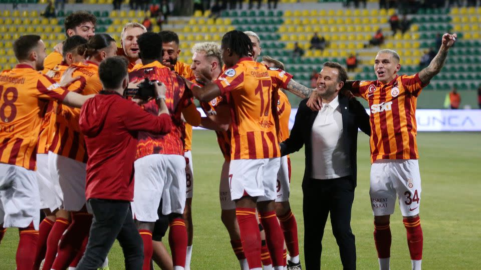 Galatasaray players celebrate their unusual Super Cup victory. - Stringer/Reuters
