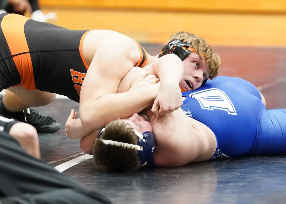 Hudson 215-pounder Cam Kimble, left, works to pin Dundee's Aiden Massingill during their bout at Wednesday night's LCAA dual meet in Hudson. Kimble picked up the pinfall victory in 1:04.