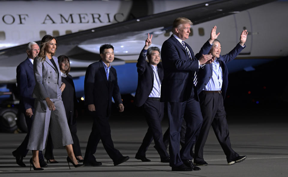 <p>President Donald Trump walks with Tony Kim, fourth right, Kim Hak-song, third right, Kim Dong- chul, right, the three Americans detained in North Korea for more than a year as they arrive at Andrews Air Force Base in Md., Thursday, May 10, 2018. Walking with Trump is Vice President Mike Pence, left, and first lady Melania Trump. (Photo: Susan Walsh/AP) </p>