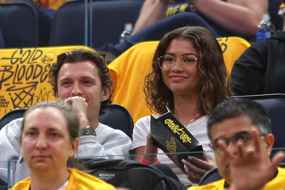 Tom Holland and Zendaya at a basketball game