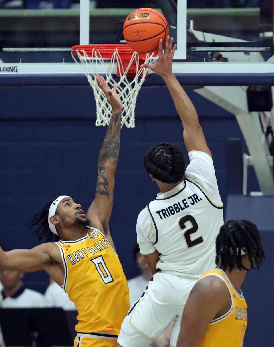Kent State Golden Flashes guard Julius Rollins (0) fails to block the shot of Akron Zips guard Greg Tribble (2) during the second half of an NCAA college basketball game, Friday, Feb. 23, 2024, in Akron, Ohio.