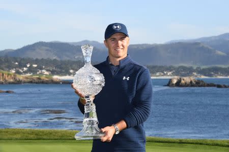 February 12, 2017; Pebble Beach, CA, USA; Jordan Spieth poses with the trophy on the 18th green during the final round of the AT&T Pebble Beach Pro-Am golf tournament at Pebble Beach Golf Links. Mandatory Credit: Kyle Terada-USA TODAY Sports
