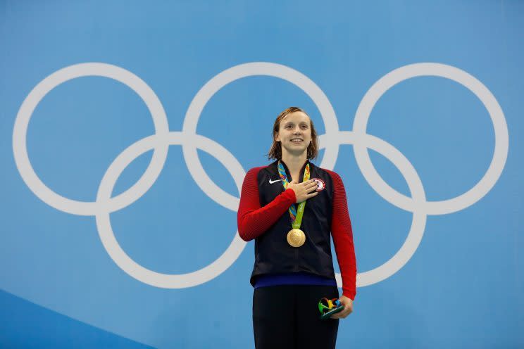Gold medalist Katie Ledecky of the United States poses on the podium during the medal ceremony for the Women's 400m Freestyle Final. (Getty)