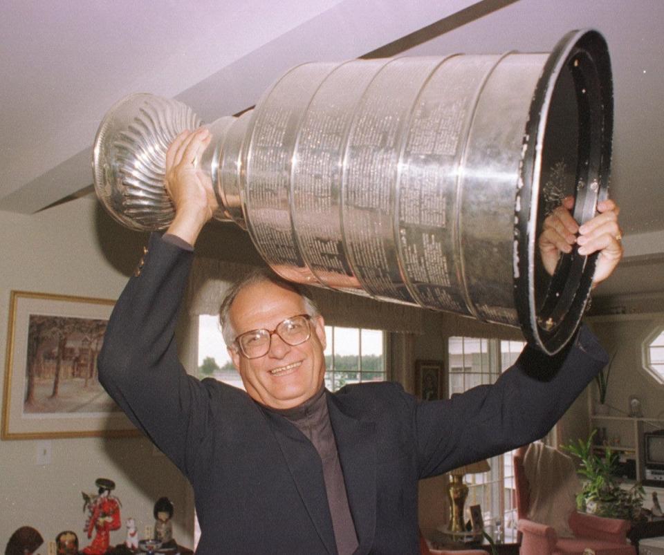 Charlie Vincent hoists the Stanley Cup.