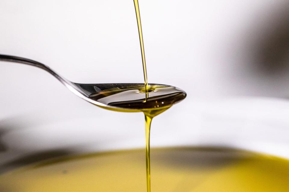 olive oil on spoon