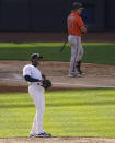 New York Yankees relief pitcher Aroldis Chapman, left, reacts after striking out Baltimore Orioles' Pat Valaika (74) to close the ninth inning of a baseball game, Saturday, Sept. 12, 2020, in New York. (AP Photo/John Minchillo)