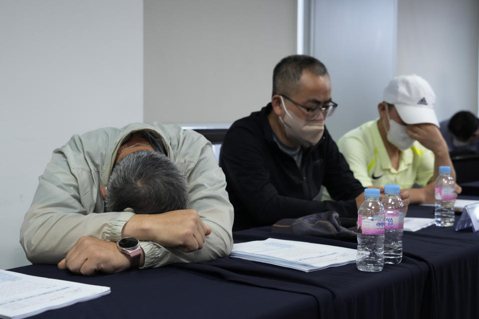 Victims of Brothers Home attend a press conference at the Truth and Reconciliation Commission office in Seoul, South Korea, Wednesday, Aug. 24, 2022. The commission has found the country's past military governments responsible for atrocities committed at Brothers Home, a state-funded vagrants' facility where thousands were enslaved and abused from the 1960s to 1980s. (AP Photo/Ahn Young-joon)