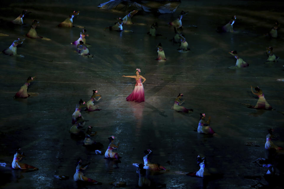 Dancers perform during the opening ceremony of the 31st Southeast Asian Games in Hanoi, Vietnam Sunday, May 12, 2022. The SEA Games 31 takes place from May 12 to May 23 in Hanoi, and 11 nearby provinces. (AP Photo/Minh Hoang)