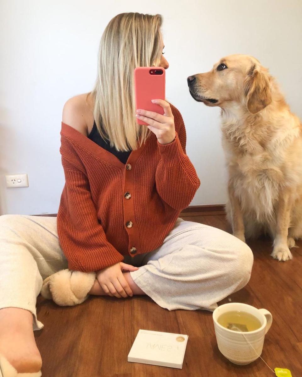 Woman with dog in winter cardigan