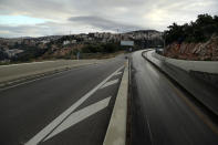 A highway is empty during a lockdown aimed at curbing the spread of the coronavirus, in the Beirut suburb of Roumieh, Lebanon, Thursday, Jan. 14, 2021. Lebanese authorities began enforcing an 11-day nationwide shutdown and round the clock curfew Thursday, hoping to limit the spread of coronavirus infections spinning out of control after the holiday period. (AP Photo/Bilal Hussein)