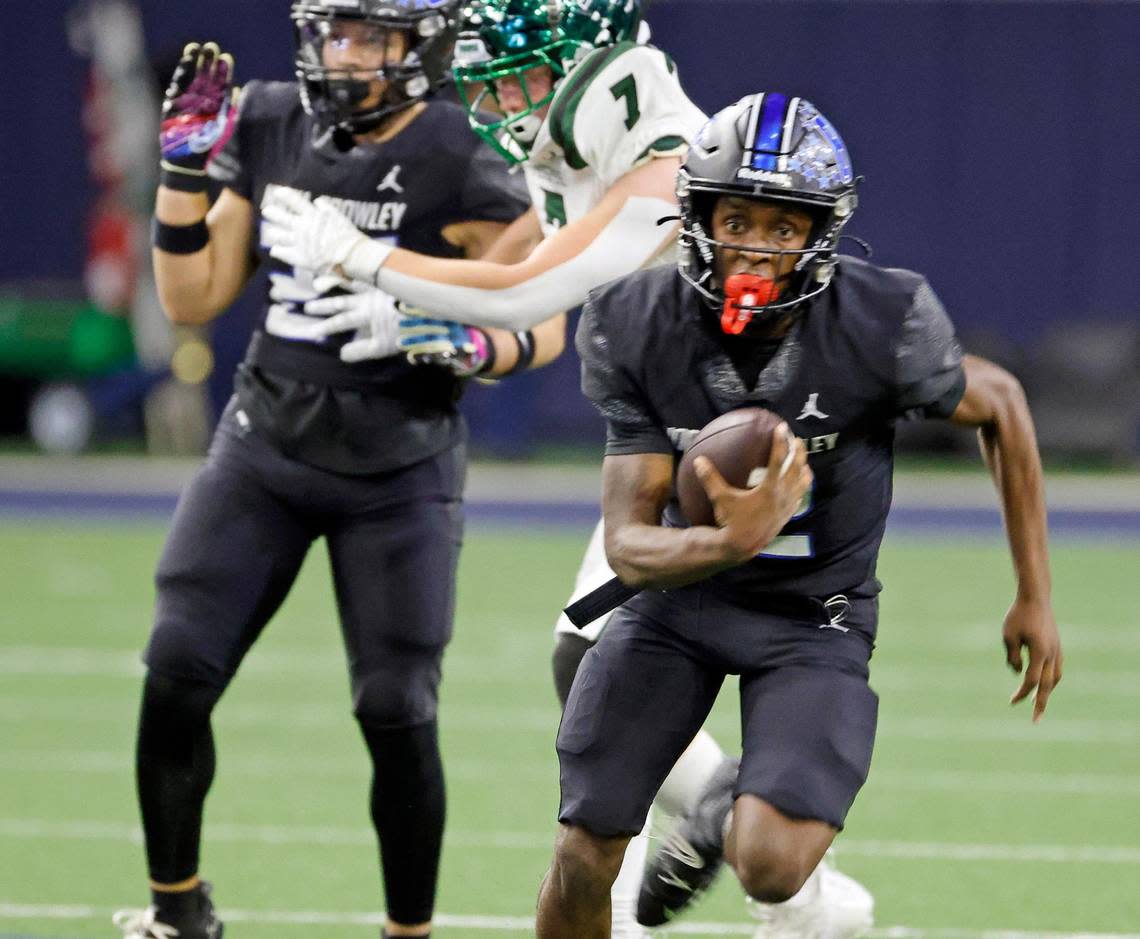 North Crowley quarterback Chris Jimerson (12) scrambles out of the backfield in the first half of a UIL Class 6A Division 1 football regional-round playoff game at The Ford Center in Frisco, Texas, Saturday, Oct. 25, 2023. North Crowley led Prosper 28-7 at the half.