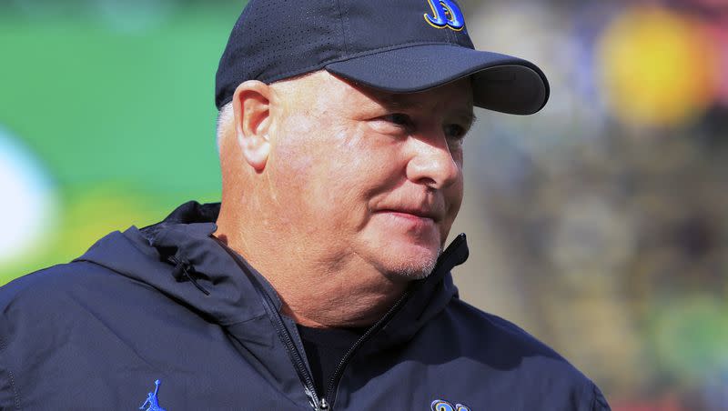 UCLA coach Chip Kelly watches warmups before a game against Oregon Saturday, Oct. 22, 2022, in Eugene, Ore. Kelly has the Bruins trending in the right direction but has big holes to fill heading into the 2023 season.