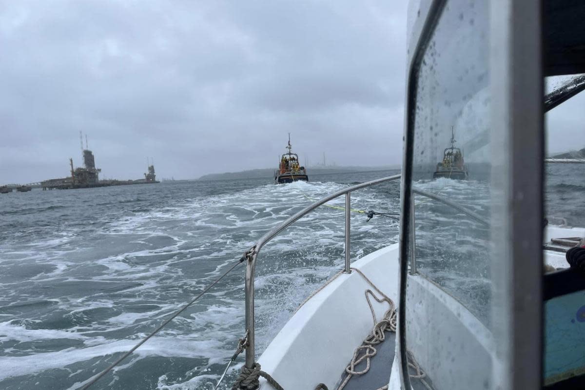 Angle RNLI's all-weather lifeboat tows a stranded vessel back in to Milford Marina. <i>(Image: Angle RNLI)</i>