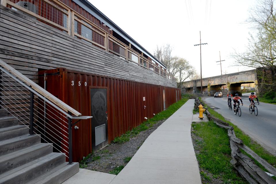 Smoky Park Supper Club is made out of shipping containers with a large outdoor patio facing the river. 