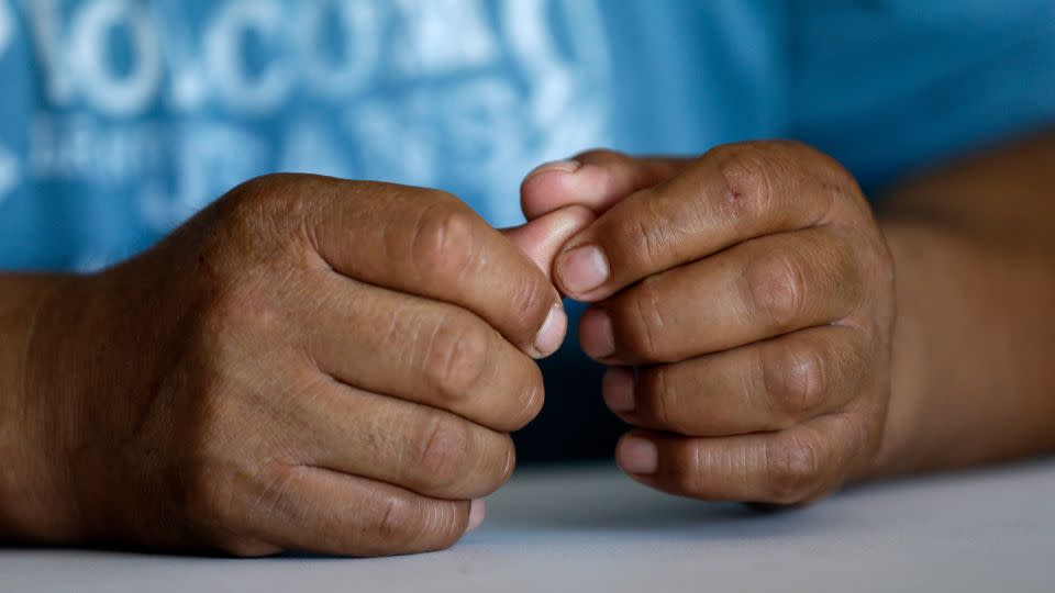 A Mexican immigrant who saved enough to open a small business speaks to a reporter in North Carolina in 2016. - Gerry Broome/AP