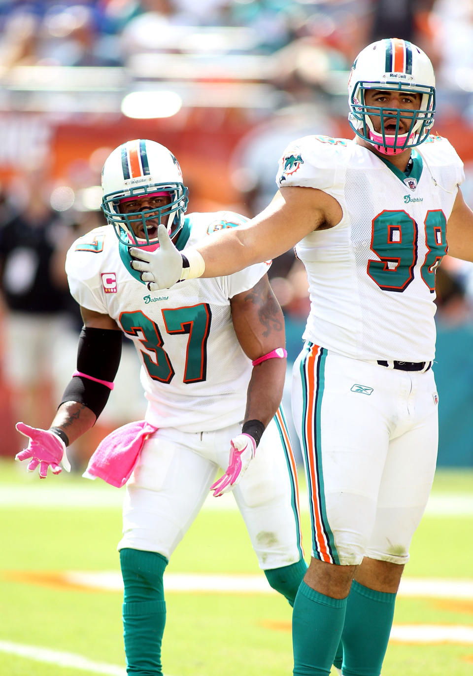 MIAMI GARDENS, FL - OCTOBER 23: Defensive back Yeremiah Bell #37 and Linebacker Jared Odrick #98 the Miami Dolphins complain over a call against the Denver Broncos at Sun Life Stadium on October 23, 2011 in Miami Gardens, Florida. (Photo by Marc Serota/Getty Images)