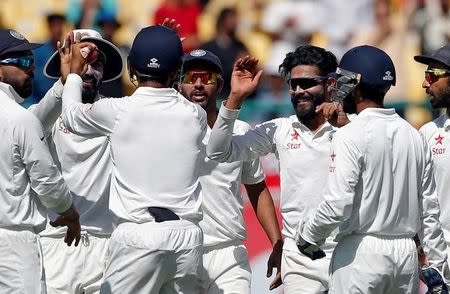 Cricket - India v Australia - Fourth Test cricket match - Himachal Pradesh Cricket Association Stadium, Dharamsala, India - 27/03/17 - India's Ravindra Jadeja (3-R) celebrates with his teammates after dismissing Australia's Shaun Marsh. REUTERS/Adnan Abidi