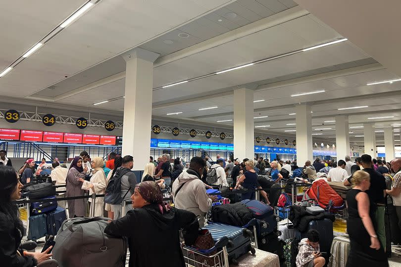 Huge queues at Terminal 1 of Manchester Airport after all flights were cancelled 'until further notice'