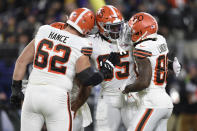Cleveland Browns tight end David Njoku, center right, is congratulated by offensive tackle Blake Hance (62), running back Nick Chubb (24) and wide receiver Jarvis Landry (80) after Njoku caught a touchdown pass against the Baltimore Ravens during the second half of an NFL football game, Sunday, Nov. 28, 2021, in Baltimore. (AP Photo/Gail Burton)