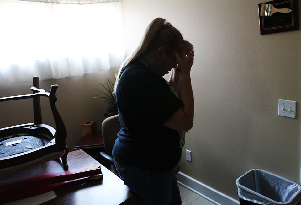 Mary <strong></strong>Woods&nbsp;holds her head in her hands as she shows off some of the damage Harvey left at the domestic violence shelter she works at in Humble, Texas. (Photo: Andy Campbell/HuffPost)