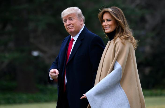 President Trump and first lady Melania Trump walk to Marine One before departing from the South Lawn of the White House last month. (Andrew Caballero-Reynolds/AFP via Getty Images)