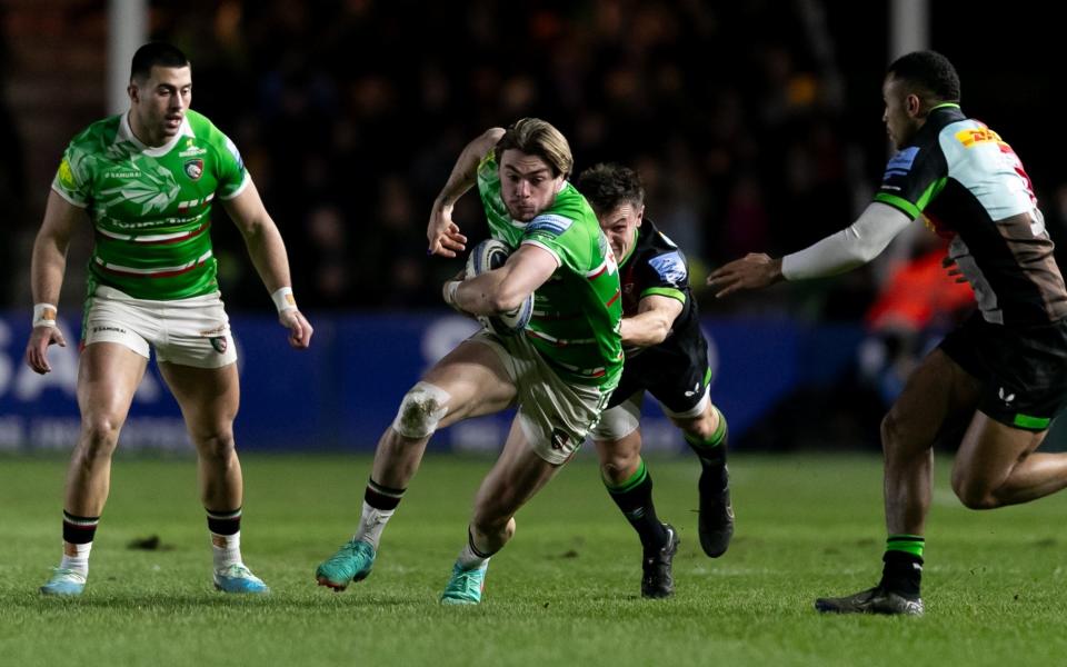 Ollie Hassell-Collins of Leicester Tigers is tackled by Jarrod Evans of Harlequins during the Gallagher Premiership