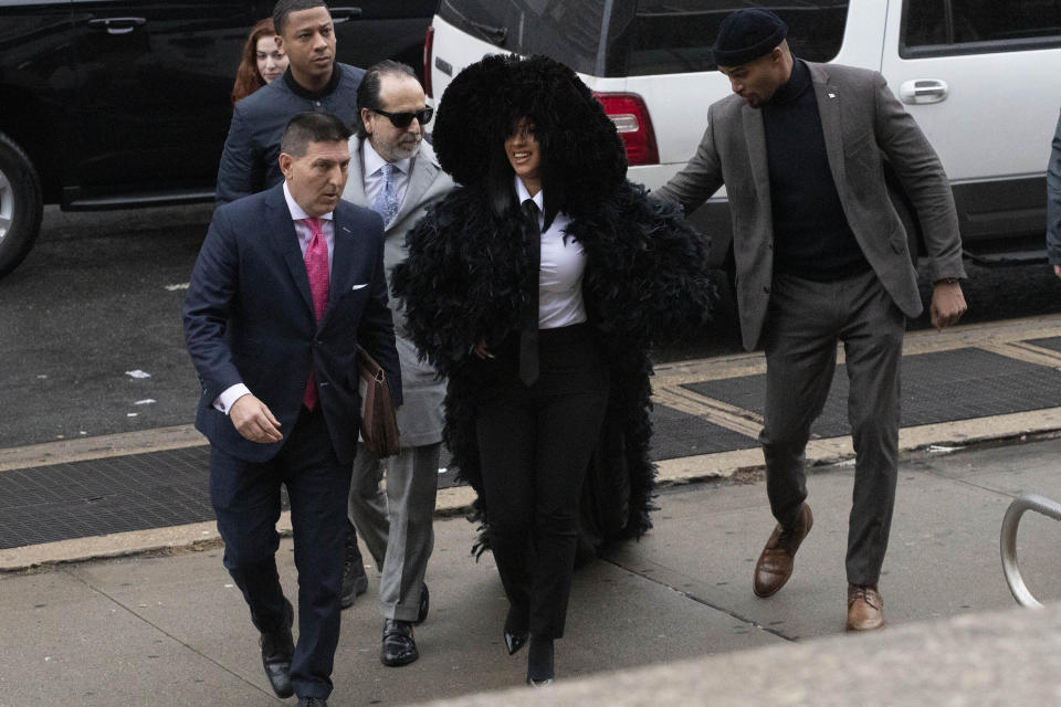 Rapper Cardi B arrives at Queens Criminal Court on charges stemming from an 2018 fight at a Queens strip club, Tuesday, Dec. 10, 2019 in New York. Prosecutors obtained a felony indictment in June. (AP Photo/Mark Lennihan)