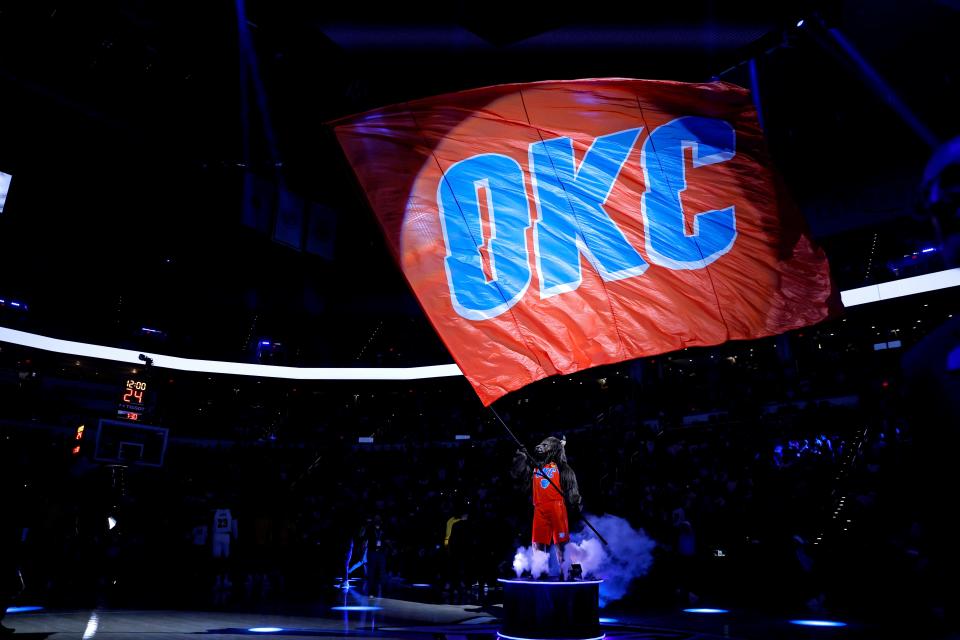 Rumble waves a Thunder flag before an NBA basketball game between the Oklahoma City Thunder and the Los Angeles Lakers at Paycom Center in Oklahoma City, Saturday, Dec. 23, 2023. the Thunder lost 129-120.