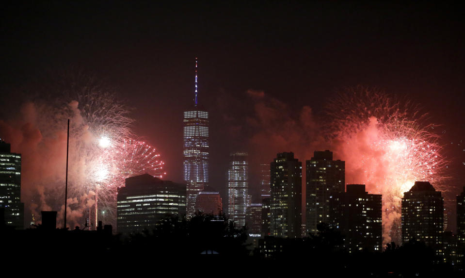 Fireworks explode over buildings from Jersey City, N.J., and New York City’s Lower Manhattan, including One World Trade Center, center left, during a Fourth of July celebration, Wednesday, July 4, 2018, in Jersey City, N.J. (AP Photo/Julio Cortez)