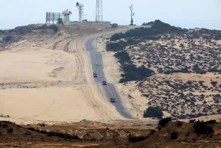 FILE PHOTO: Israel military vehicles patrol the Israeli side of the Israel-Gaza border January 25, 2017. REUTERS/Amir Cohen/File Photo