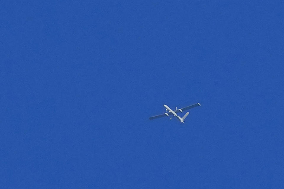 An Israeli reconnaissance drone flies over Lebanon as seen from Tair Harfa village, a Lebanese border village with Israel, south Lebanon, Friday, Oct. 20, 2023. (AP Photo/Hassan Ammar)