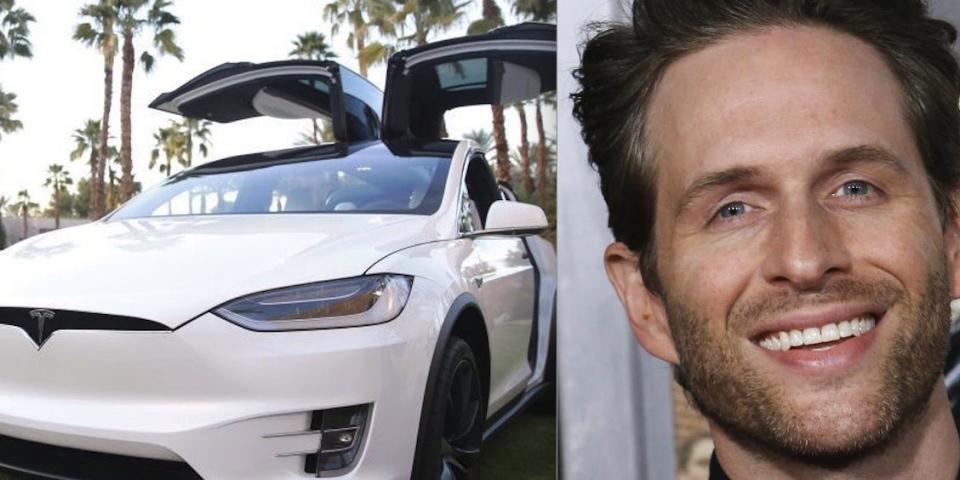 A Model X next to Glenn Howerton