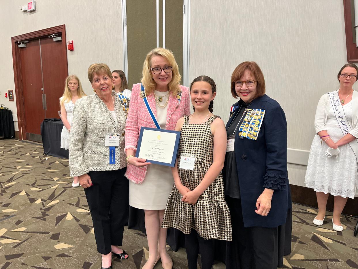 Bruce Drysdale Elementary School's Lia Martinonis was honored April 20 in Durham for winning first place in the state in the Daughters of the American Revolution essay contest. She also won the Southeastern Division and has advanced to the national competition.