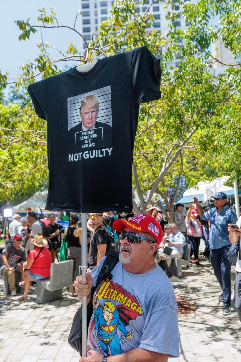 A Trump supporter holds a sign outside at the Wilkie D. Ferguson Jr. U.S. Courthouse, Tuesday, June 13, 2023, in Miami, prior to former President Donald Trump making a federal court appearance on dozens of felony charges accusing him of illegally hoarding classified documents.