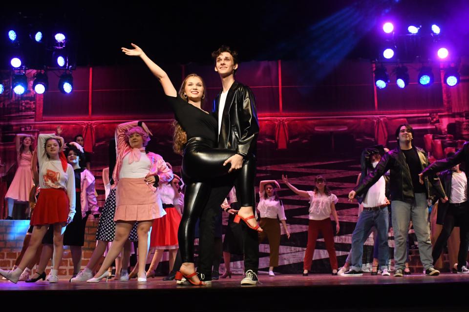 Matthew McQuain (right) as Danny Zuko and Karly Stansell as Sandy practice in the Pinevile High School Theatre production of "Grease." The show opens Thursday night and runs through Sunday.