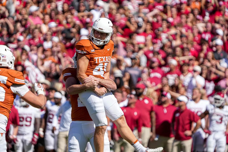 Placekicker Bert Auburn, right, celebrates a 47-yard field goal to give the Longhorns a lead late in their loss to Oklahoma on Oct. 7 in Dallas. Auburn has made 12 of 17 field goal tries this season.