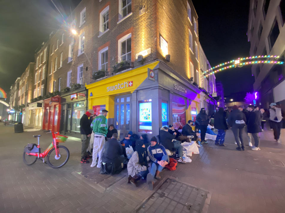 Customers in line overnight for the launch of the MoonSwatch at the Swatch store on Carnaby Street, central London. The Omega x Swatch collaboration is a collection of solar system-inspired watches based on Omega's Moonwatch, the first wristwatch worn on the moon, but available for a fraction of the price. Picture date: Saturday March 26, 2022. (Photo by Yui Mok/PA Images via Getty Images)