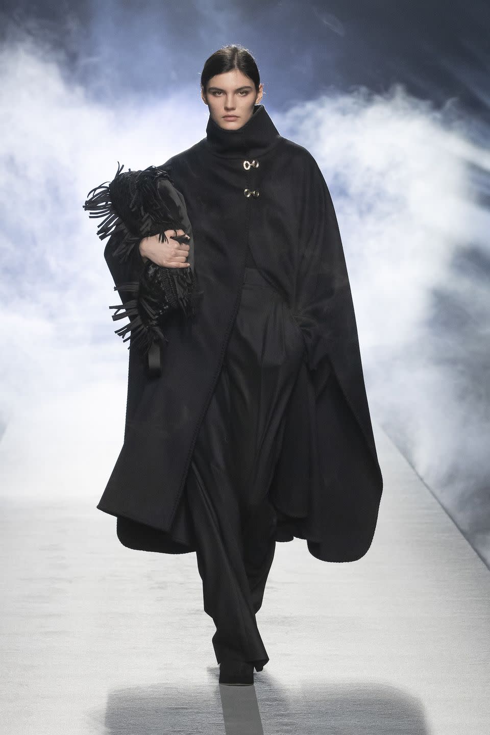 <p>All things comfy and cozy reached new heights in Alberta Ferretti’s fall 2021 collection. The Italian designer, via video of a runway show, presented a lineup of cold-weather staples—blanket capes, shearling coats, cashmere sweaters, turtlenecks, and suede trousers—that, though roomy in cut, were tailored with precision and featured hand-stitched details. Ferretti started with black and charcoal-gray hues, gradually adding flesh tones, pine green, mustard yellow, robin's-egg blue, and shimmering gold. The overall vibe was relaxed minimalism with a dose of glamour. And though known primarily for being a red-carpet favorite, her recent offering proved that she is equally adept in creating luxe, no-fuss daywear. —<em>Barry Samaha </em></p>