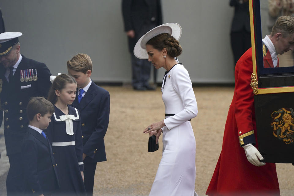 Britain's Kate, Princess of Wales, Prince Louis, front, Princess Charlotte and Prince George arrive for the Trooping the Color ceremony at Horse Guards Parade, London, Saturday, June 15, 2024. Britain is putting on a display of birthday pageantry for King Charles III, a military parade that is the Princess of Wales’ first public appearance since her cancer diagnosis early this year. (Yui Mok/PA via AP)