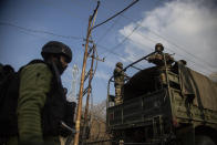 Indian security officers patrol near the site of an attack on the outskirts of Srinagar, Indian controlled Kashmir, Thursday, Nov. 26, 2020. Anti-India rebels in Indian-controlled Kashmir Thursday killed two soldiers in an attack in the disputed region’s main city, the Indian army said.(AP Photo/Mukhtar Khan)