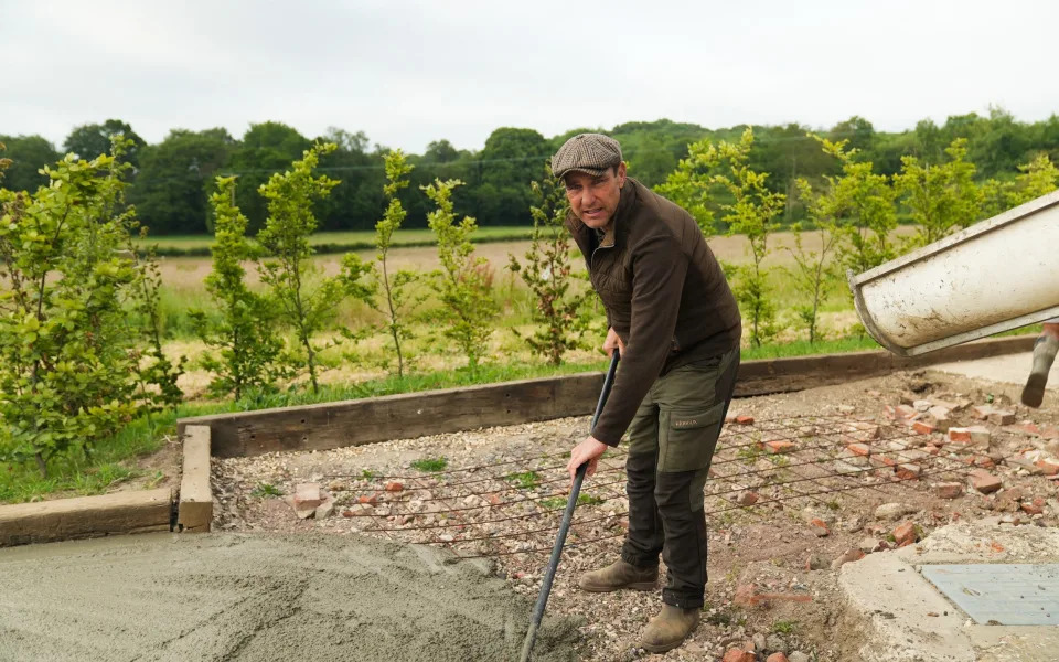 Vinnie Jones helping with the cement pour at Limbo Farm