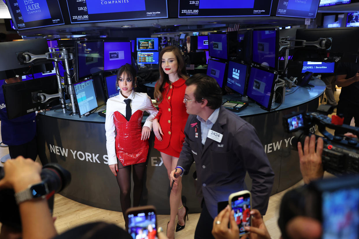 NEW YORK, NEW YORK - JUNE 12: IVA GLAM 30 Ambassadors Danna Paola and Kim Petras pose for photos as raders work on the floor of the New York Stock Exchange during morning trading on June 12, 2024 in New York City. The three major stock indexes opened up high amid an interest rate decision by the Federal Reserve and May’s consumer inflation data that showed inflation falling slightly to 3.3%. (Photo by Michael M. Santiago/Getty Images)