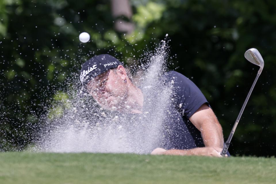 Patton Kizzire hits out of a bunker onto the fifth green during the third round of the Charles Schwab Challenge golf tournament at Colonial Country Club in Fort Worth, Texas, Saturday May 29, 2021. (AP Photo/Ron Jenkins)