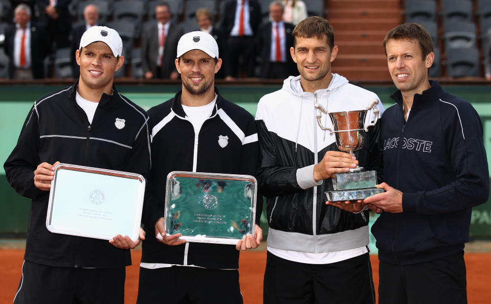 PARIS, FRANCE - JUNE 09: Bob (L) and Mike Bryan of the USA pose with winners Max Mirnyi of Belarus and Daniel Nestor (R) of Canada after the men's doubles final during day 14 of the French Open at Roland Garros on June 9, 2012 in Paris, France. (Photo by Matthew Stockman/Getty Images)