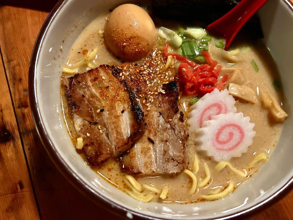 A bowl of Easy Tyger's Tonkotsu Ramen is highlighted by a 24-hour pork broth and tender pork belly, plus soy-marinated egg, fish cake, and loads of veggies.