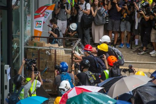 Protesters used a cart as a battering ram on the city's parliament  After some six hours the anti-government demonstrators breached the government headquarters in Hong Kong.  Source: AFP